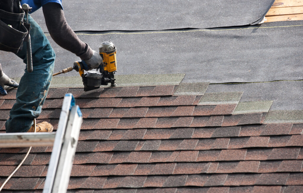 Roofers Installing A New Roof On Residential Home.