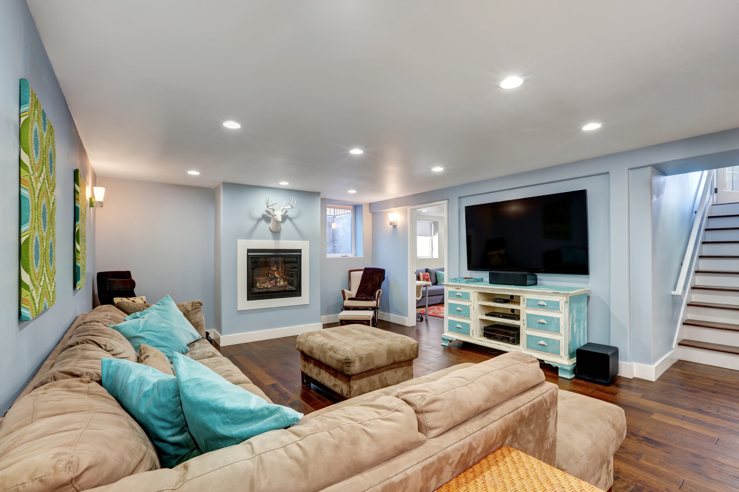 Pastel blue walls in basement living room interior. Pastel blue walls in the basement living room interior.