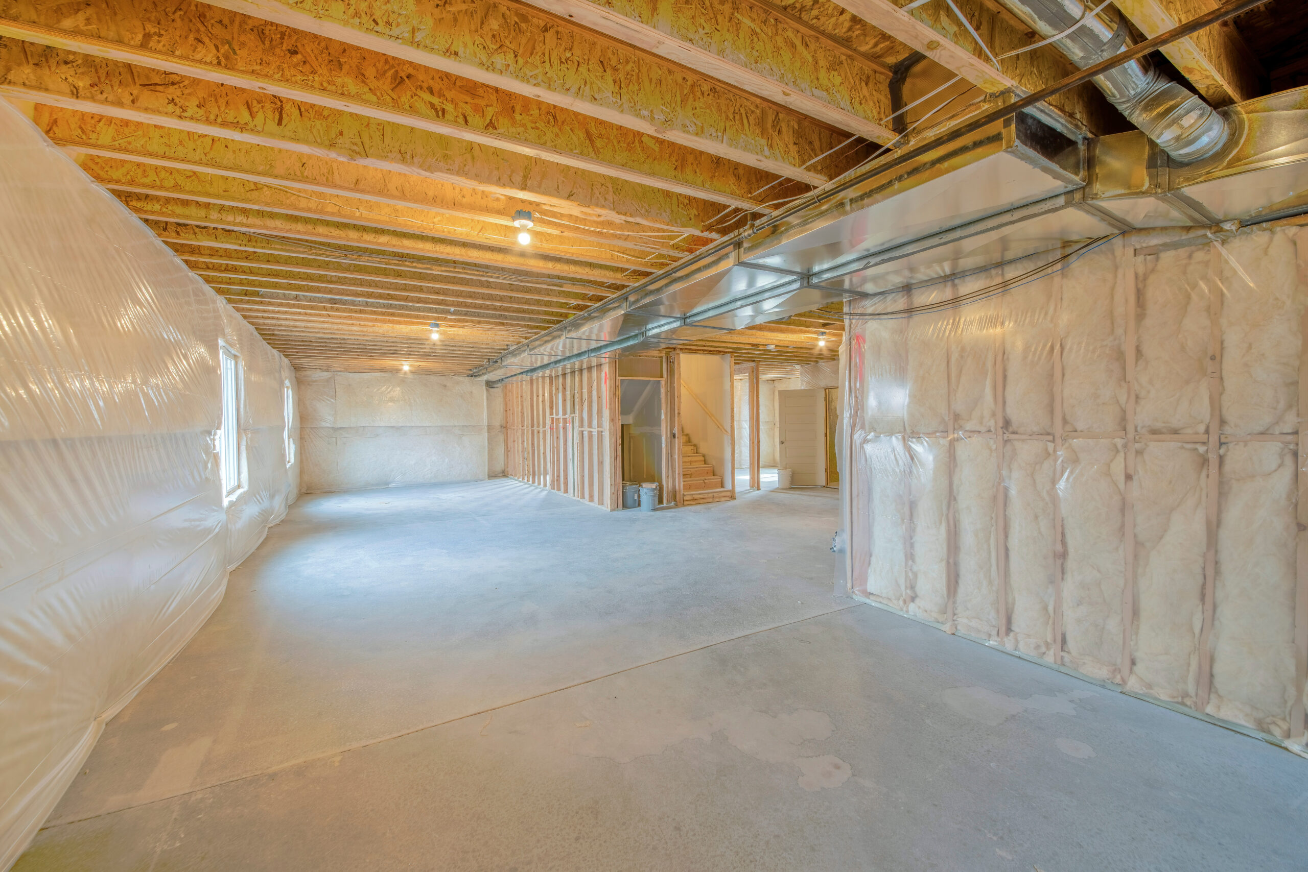 Large Unfinished Basement with Woodframes and Wall Insulation.